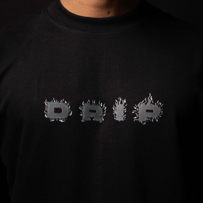 Black sweatshirt with 'DRIP' text design on a dark background